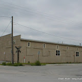 Old warehouse building along South Main Street in Fremont, Nebraska. Note the weathered railroad crossing sign