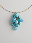 18ct gold and turquoise pendant on an 18ct gold wire. 550.00