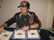 Vince Kelvin Signing Awards For The 2009 Pua Summit