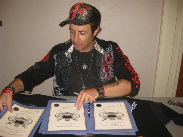 Vince Kelvin Signing Awards For The 2009 Pua Summit, Johnny Wolf