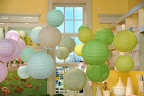 Inexpensive paper lanterns from Luna Bazaar (www.lunabazaar.com) come in a wide spectrum of colors and make a big impact when grouped en masse.
