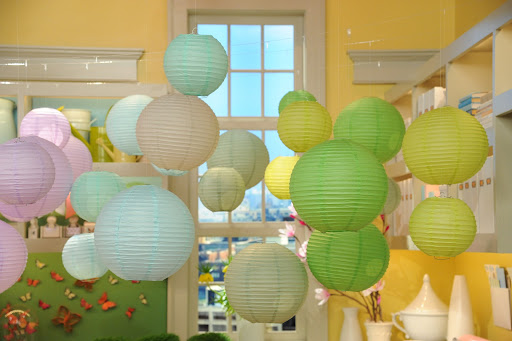 Inexpensive paper lanterns from Luna Bazaar (www.lunabazaar.com) come in a wide spectrum of colors and make a big impact when grouped en masse.