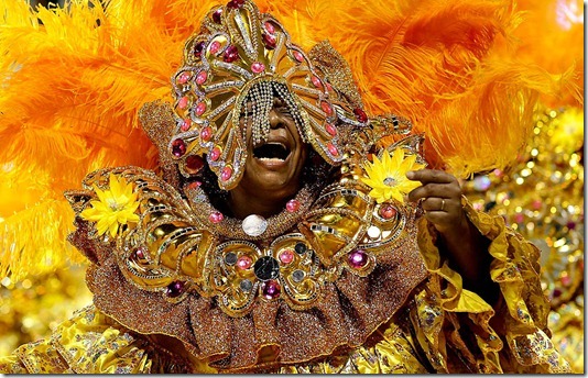 A dancer performs during the Carnival parade of the Camisa Verde e Branco samba school in Sao Paulo. (Andre Penner/Associated Press)