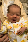 Now you may look at this photo and say "that baby looks like it's either crying/yawning, or about to", but we like to think that this is just one step to her singing beautifully. Her breath control is remarkable for her age.