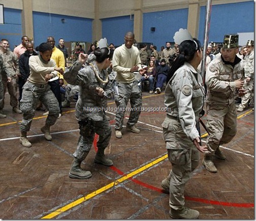 Troops from the US led International Security Assistance Force (ISAF) and service members dance during their celebrations1