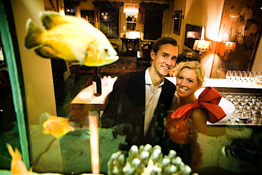 Colman and Katie paused for a photo through the large fish tank. Colman and Katie paused for a photo through the large fish tank.