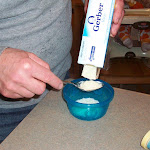 Daddy mixing up my first rice cereal.JPG