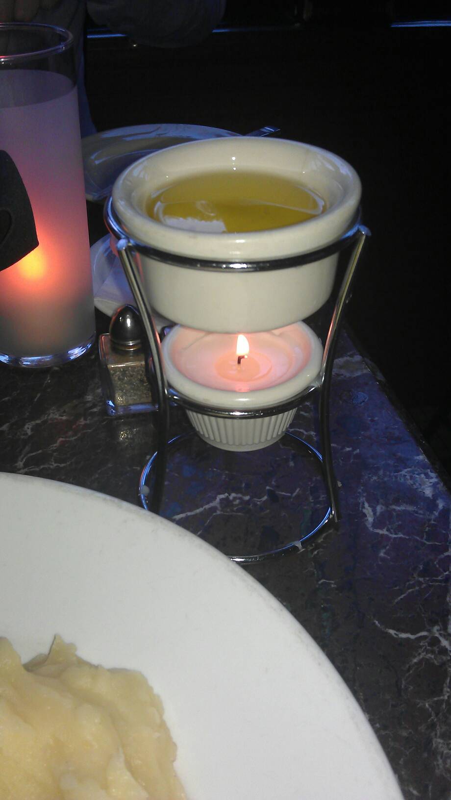With candle lit drawn butter