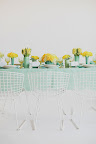 Combining high and low vases with groupings of flowers packs a visual punch.