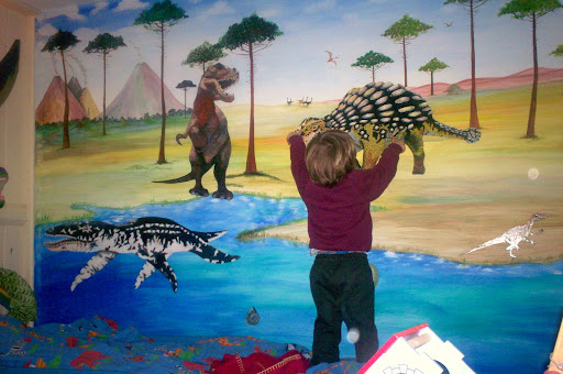 Mural with magnetic paint on wall, figures can move.