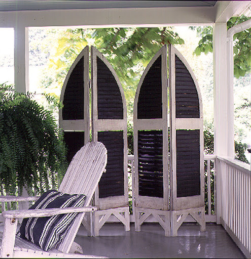 This clever screen made from antique shutters makes provides privacy and design interest on a porch. (Martha Stewart Living) This clever screen made from antique shutters makes provides privacy and design interest on a porch. (Martha Stewart Living)