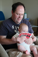 Adam helping Jason with his card game