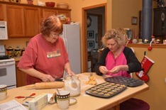 Sue and Deb concentrating on pumpkin tartlets