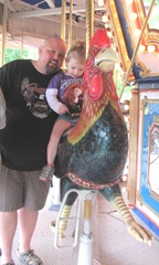 Buttonwood park 7.25.2013 Bellz and Steven riding the carousel chicken2