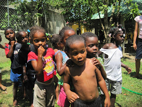Ismael, Wiltono, Merili, Erickson, Manuel and Vanessa watching the water race.