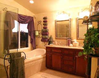 Pramik Master Bath - This romantic bathroom contains a new larger window. The shower, tub, vanity, mirror, lighting, flooring, and paint are new.