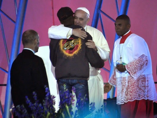 Pope Francis embraces a young man at World Youth Day Rio in 2013
