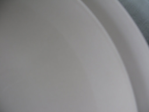 It's hard to see in this photo, but these Donna Karan plates have a mix of matte and glossy finishes.