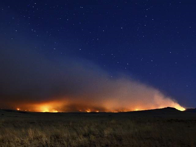 The Wallow Fire lights the night skies near Springerville, 9 June 2011. Eric English