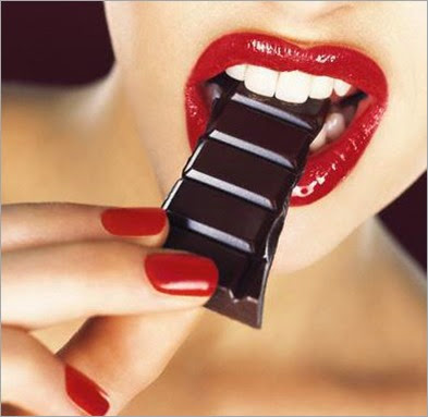 red_mouth_eating_dark_chocolate