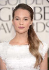 Alicia Vikander's youthful look paired perfectly with her snowy, fringed dress. Makeup artist Vanessa Scali focused on priming the skin first. Serum, Chanel Sublimage Essential Regenerating Fluid, and an eye cream gave Vikander's skin a natural glow. Illuminating powder and rosy blush finished if off. Photo courtesy of Chanel.