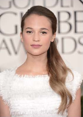 Alicia Vikander's youthful look paired perfectly with her snowy, fringed dress. Makeup artist Vanessa Scali focused on priming the skin first. Serum, Chanel Sublimage Essential Regenerating Fluid, and an eye cream gave Vikander's skin a natural glow. Illuminating powder and rosy blush finished if off. Photo courtesy of Chanel.