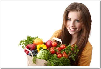 woman holding a bag full of healthy food. shopping .