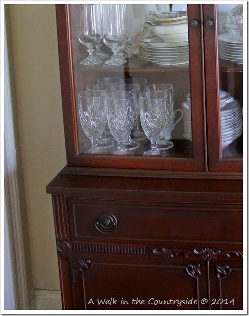 fleur de lis accent on china cabinet