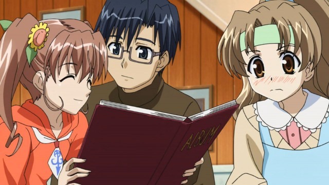 Mika smiles as she shows Yuuta a family photo album as Haruka looks on with obvious concerned embarassment