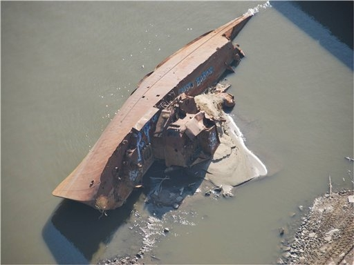 The drought revealed this WWII minesweeper, seen here on 28 November 2012 on the Mississippi River near St. Louis, Missouri. Colby Buchanan, US Coast Guard, via AP