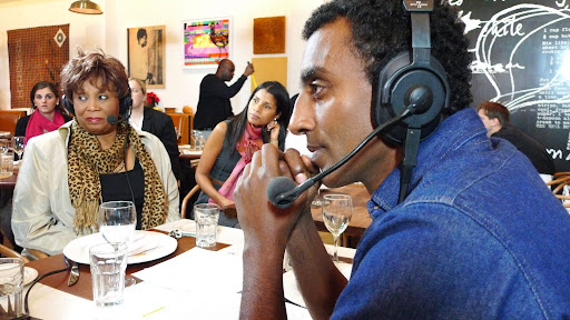 Marcus intently listening to Thelma Golden's story about Harlem's Studio Museum. Marcus intently listening to Thelma Golden's story about Harlem's Studio Museum.