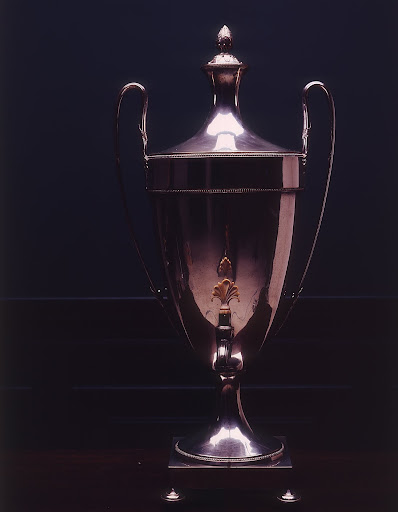 Here is a water urn with an ivory-topped spigot.