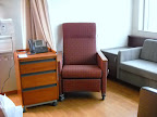 Room 5531, guest armchair and night table