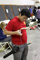 Learning how to string a bow with a bow stringer!