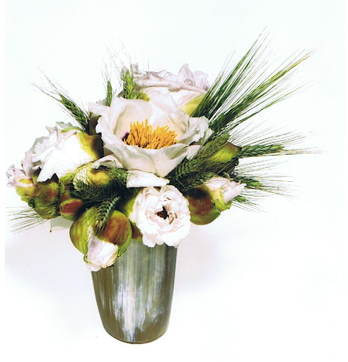 Bronson recommends a mix of high and low elements in an arrangement: Japanese peonies and dried wheat in an antique horn vase. Bronson recommends a mix of high and low elements in an arrangement: Japanese peonies and dried wheat in an antique horn vase.