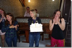 The birthday girls Fi and Anna with Pernille presenting them one of their enormous cakes