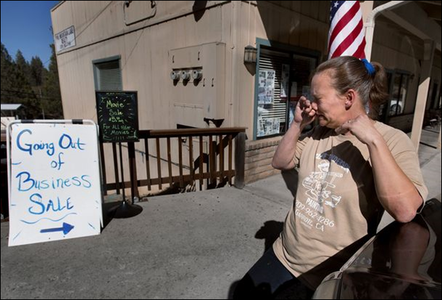 Pamela Harris sheds tears as she closes the doors of her Pine Mountain Deli after 10 years in business in Groveland, California, on the outskirts of Yosemite National Park. Businesses in the area of Yosemite National Park took a double hit as first the Rim Fire wildfire kept visitors away followed by the federal budget shutdown of the park. Photo: Randall Benton / MCT