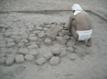 Model making adobe bricks, Huaca Pucllana, Lima, Peru. (October 2008)