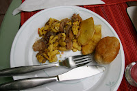 Saltfish and Ackee, breadfruit, and johnny cakes