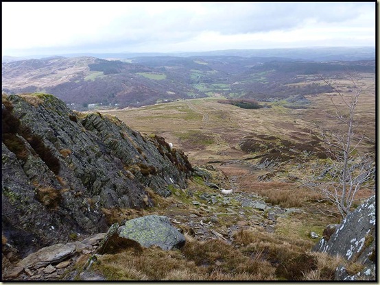 A view to Capel Curig from the lower part of the NE ridge - a grassy corridor between fins of slate