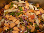Vegetables in the pot get cooked until softened.