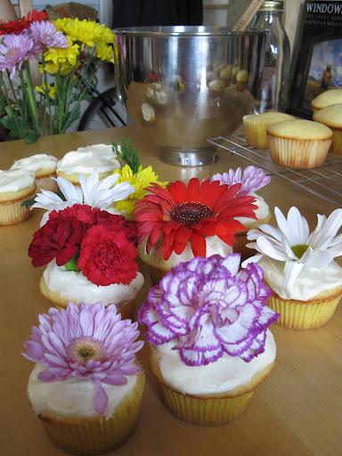 APRIL SHOWERS BRING MAY FLOWERS: Terri Trespicio, host of Whole Living on Martha Stewart Living Radio chooses to embellish her cupcakes with fresh flowers. Her cupcakes are topped with carnations and daisies.