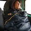 Amy wearing her sleeping bag (and all her warm clothes) in the van for today's drive.
