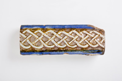 Tile | Origin: Iran | Period: Early Medieval or Late Medieval | Collection: The Madina Collection of Islamic Art, gift of Camilla Chandler Frost (M.2002.1.203a-c) | Type: Ceramic; Architectural element, Fritware, molded, underglaze- and luster-painted, a) Height: 2 7/16 in. (6.19 cm); a) Width: 12 15/16 in. (32.86 cm); a) Depth: 1 3/16 in. (3.02 cm); b) Height: 2 7/16 in. (6.19 cm); b) Width: 7 in. (17.78 cm); b) Depth: 1 1/16 in. (2.7 cm); c) Height: 2 7/16 in. (6.19 cm); c) Width: 8 1/8 in. (20.64 cm); c) Depth: 1 1/16 in. (2.7 cm)