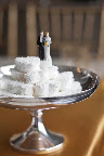 A simple topper next to white heart marshmallows. A simple topper next to white heart marshmallows.