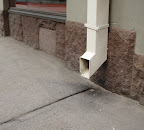 The gutter can be made of stone, or just marked like here.