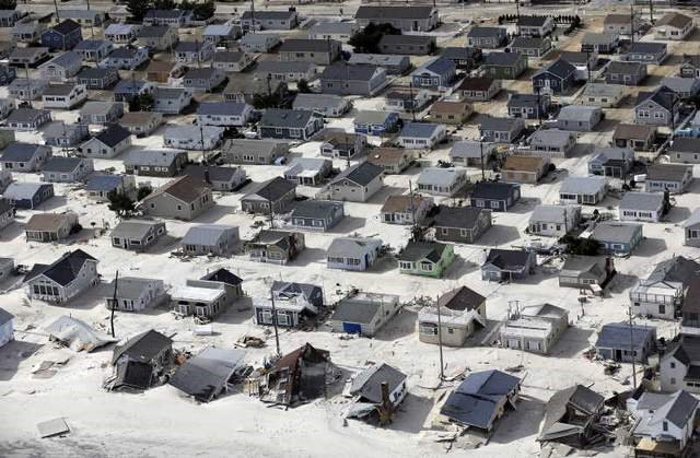 Sand fills the streets along the central Jersey shore in the wake of superstorm Sandy. Photo: MIKE GROLL / Associated Press