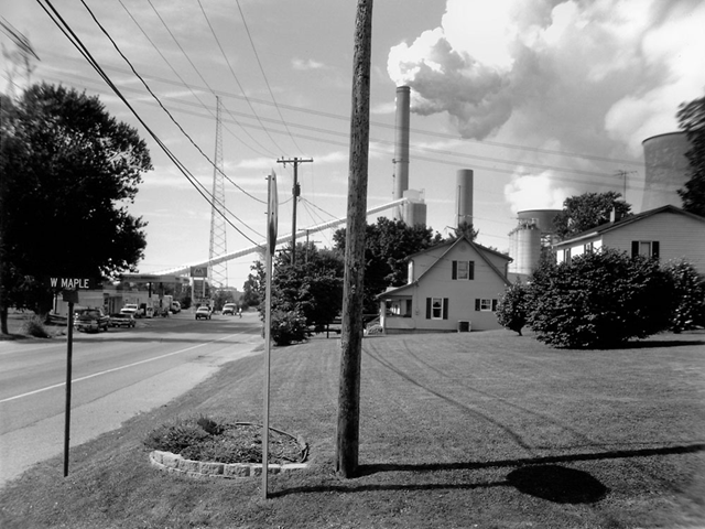 Maple Street at Route 7 in Cheshire, Ohio, 2003. Ten years ago this spring, the residents of Cheshire, Ohio, had a decision to make: They could stay in their homes and suffer the effects of pollution from a nearby coal-burning power plant; or they could let that plant's owner buy them out and, building by building, dismantle their town. In April 2002, they chose to sell. Franz Jantzen via npr.org
