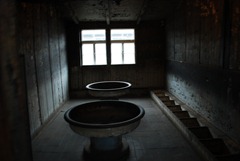 Berlin, Germany - Sachsenhausen Concentration Camp - Jewish Quarters - Wash room.  Up to 100 people could be crammed up in here to get ready for the day.  30 minutes to wake up, wash and eat before roll call.  Foot wash basins on left.