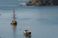 Tall ship and fishing boat